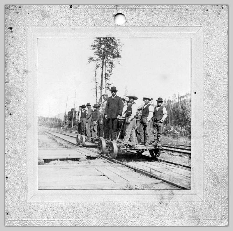Two groups of men on railroad handcars, 1904